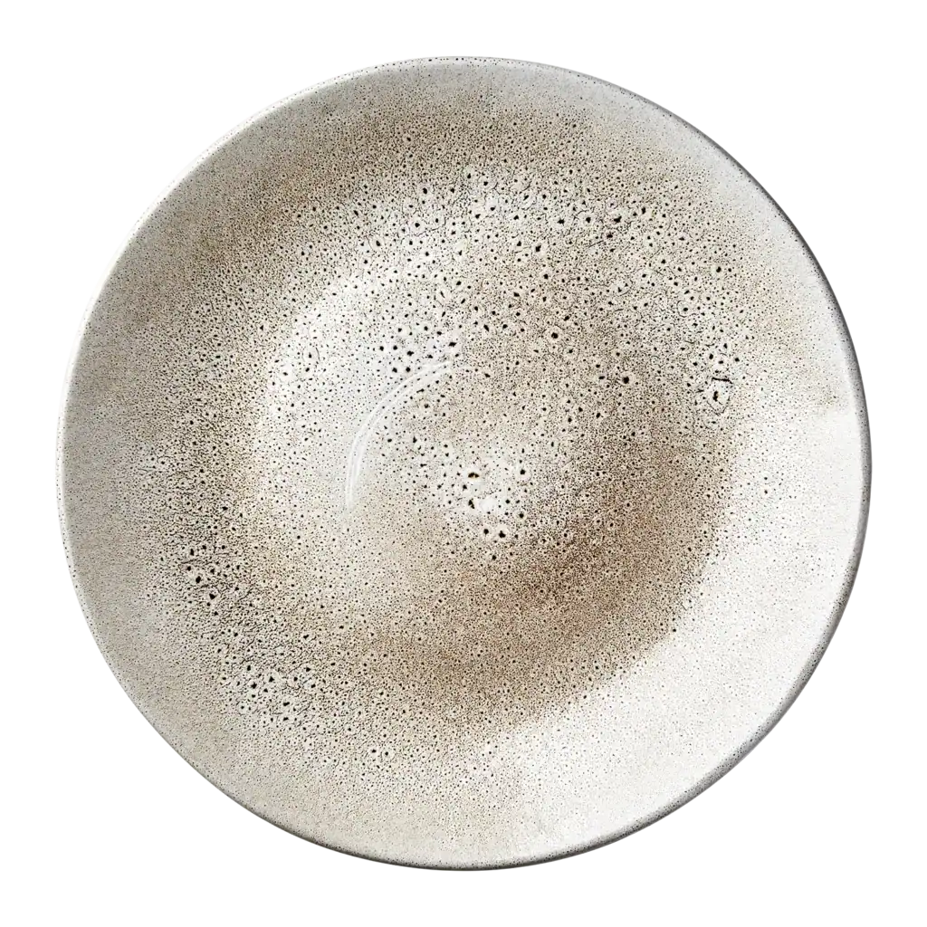 Annabelle tallrik med ett diskret, prickigt mönster i olika nyanser, sett ovanifrån. Tallriken kommer från varumärket Affari of Sweden.