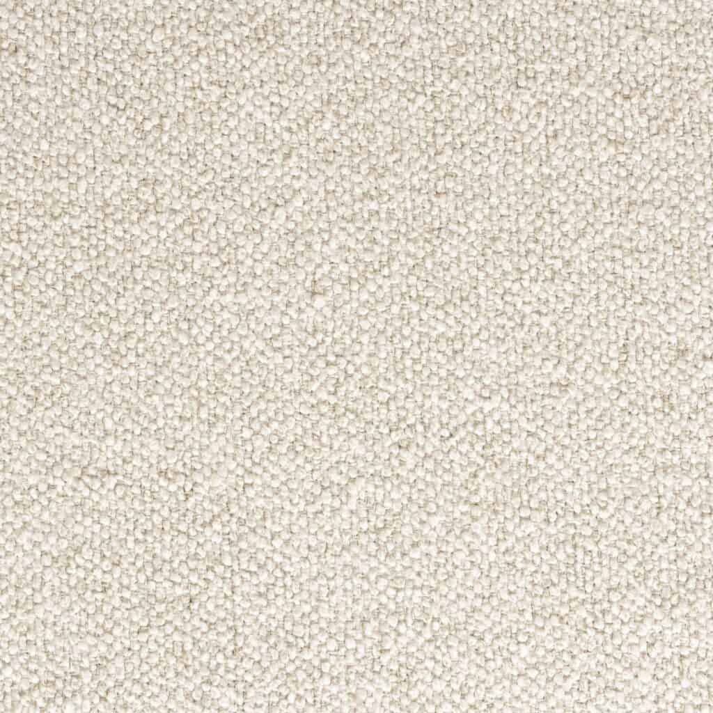 Närbild av det beige tygmaterialet på Lounge Chair Eden Latte från Zuiver, med en mjuk och strukturerad yta.