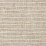 Närbild på sandfärgat strukturtyg med oregelbunden rand – Zuiver Blossom soffa