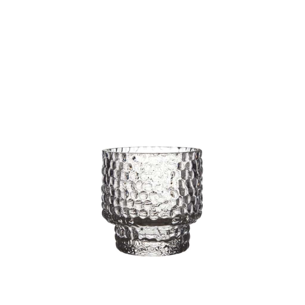 DOTTI ljuslykta i klart glas med bubblig struktur på vit bakgrund.